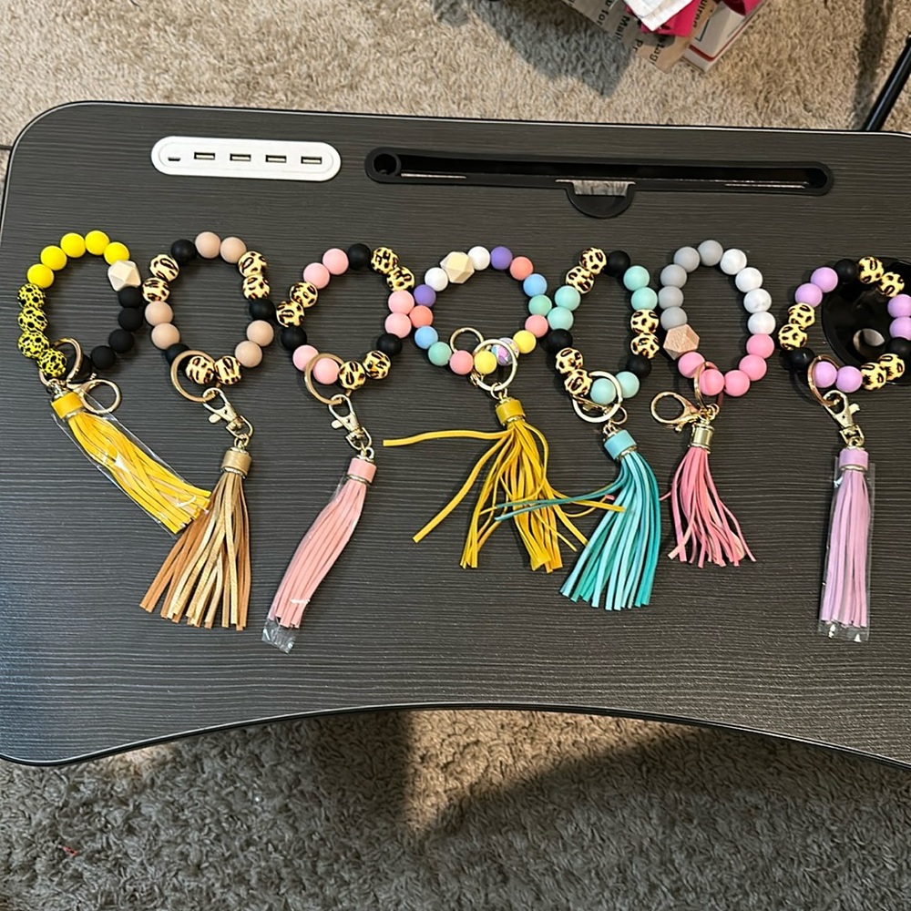 Total of 7 New Silicone bracelets with keychain